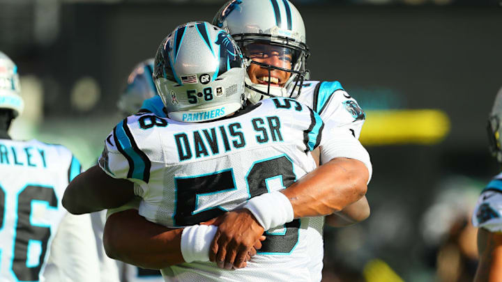 EAST RUTHERFORD, NJ - NOVEMBER 26: Carolina Panthers quarterback Cam Newton (1) hugs Carolina Panthers outside linebacker Thomas Davis (58) prior to the National Football League game between the New York Jets and the Carolina Panthers on November 26, 2017, at MetLife Stadium in East Rutherford, NJ.