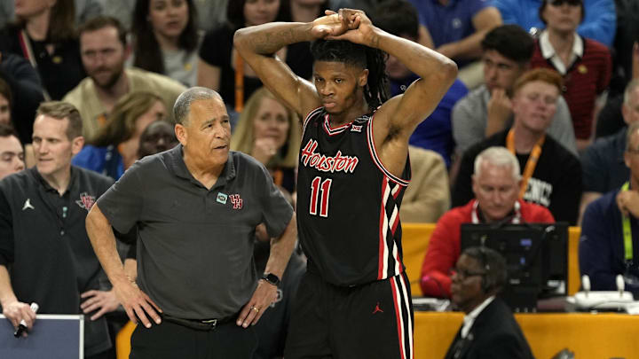 Houston coach Kelvin Sampson talks with Joseph Tugler during the Cougars' Final Four semifinal win against Duke on April 5, 2025.