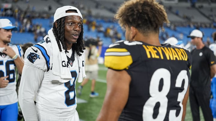 Aug 21, 2025; Charlotte, North Carolina, USA; Carolina Panthers cornerback Jaycee Horn (8) talks with Pittsburgh Steelers tight end Connor Heyward (83) after the second half at Bank of America Stadium. 