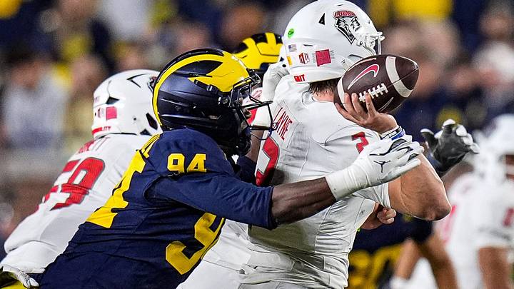 Michigan edge Nate Marshall (94) tackles New Mexico quarterback Jack Layne (2) during the second half at Michigan Stadium in Ann Arbor on Saturday, August 30, 2025.