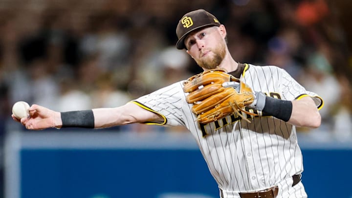 Sep 13, 2025; San Diego, California, USA; San Diego Padres shortstop Jake Cronenworth (9) throws to first base for an out during the sixth inning against the Colorado Rockies at Petco Park. Mandatory Credit: David Frerker-Imagn Images