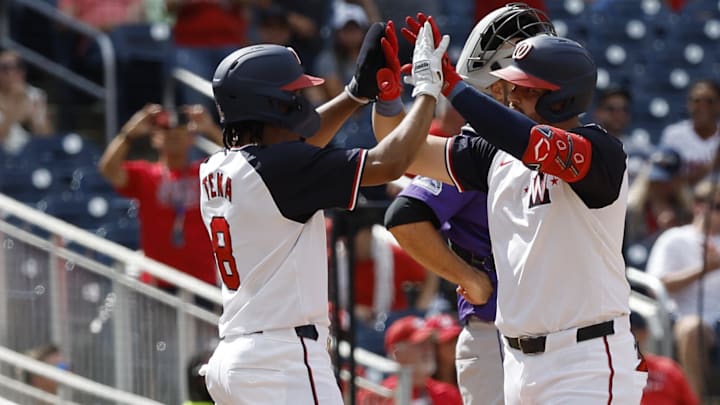 Aug 22, 2024; Washington, District of Columbia, USA; Washington Nationals designated hitter Juan Yepez (R) celebrates with Nationals third baseman José Tena (8) after hitting a three run home run against the Colorado Rockies during the eighth inning at Nationals Park.
