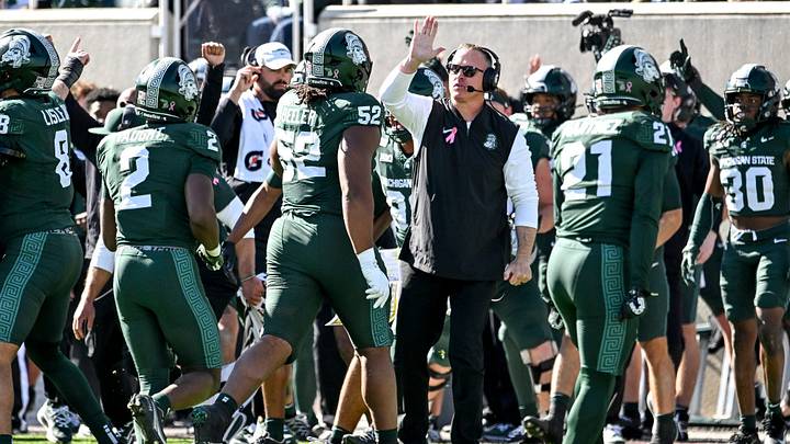 Michigan State’s head coach Pat Fitzgerald high five players after MSU blocked a Northwestern field goal during the second quarter on Saturday, Oct. 17, 2026, at Spartan Stadium in East Lansing.