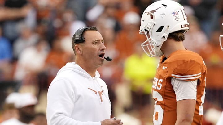 Texas Longhorns head coach Steve Sarkisian talks with quarterback Arch Manning during a timeout in the second half against the Vanderbilt Commodores at Darrell K Royal-Texas Memorial Stadium. 