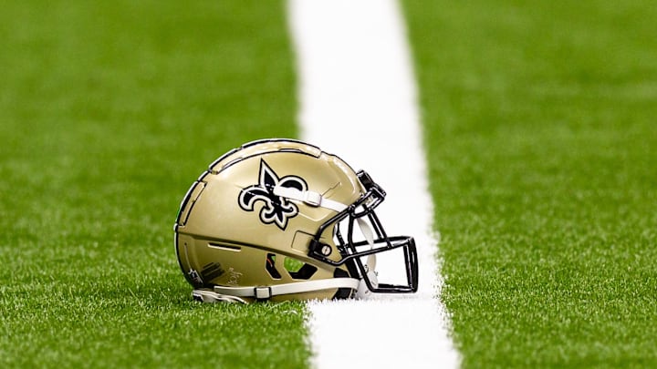 Aug 25, 2024; New Orleans, Louisiana, USA; New Orleans Saints helmet on the turf during warmups before the game against the Tennessee Titans at Caesars Superdome. Mandatory Credit: Stephen Lew-Imagn Images Aug 25, 2024; New Orleans, Louisiana, USA; New Orleans Saints helmet on the turf during warmups before the game against the Tennessee Titans at Caesars Superdome. Mandatory Credit: Stephen Lew-Imagn Images