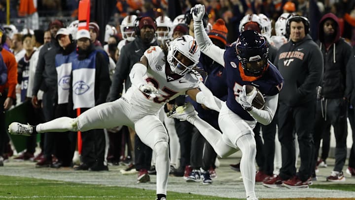 Virginia Cavaliers wide receiver Kameron Courtney and Virginia Tech Hokies cornerback Thomas Williams 