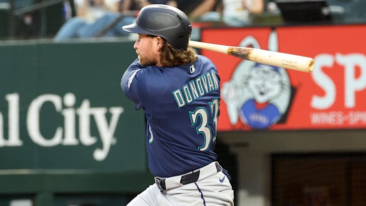 Brendan Donovan (33) hits a single during the third inning against the Texas Rangers at Globe Life Field. 