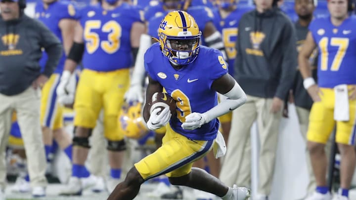 Nov 4, 2023; Pittsburgh, Pennsylvania, USA; Pittsburgh Panthers wide receiver Konata Mumpfield (9) runs after a catch against the Florida State Seminoles during the fourth quarter at Acrisure Stadium. The Seminoles won 24-7. Mandatory Credit: Charles LeClaire-Imagn Images Nov 4, 2023; Pittsburgh, Pennsylvania, USA; Pittsburgh Panthers wide receiver Konata Mumpfield (9) runs after a catch against the Florida State Seminoles during the fourth quarter at Acrisure Stadium. The Seminoles won 24-7. Mandatory Credit: Charles LeClaire-Imagn Images