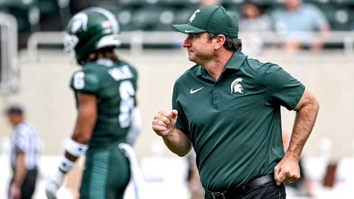 Michigan State's head coach Jonathan Smith jogs back to the sideline before the game against Youngstown State on Saturday, Sept. 13, 2025, at Spartan Stadium in East Lansing.