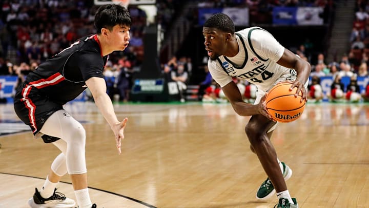 Michigan State forward Gabe Brown (44) looks to pass against Davidson guard Hyunjung Lee (1) during the second half of Michigan State's 74-73 victory over Davidson in the first round of the NCAA tournament at Bon Secours Wellness Arena in Greenville, S.C. on Friday, March 18, 2022. Michigan State forward Gabe Brown (44) looks to pass against Davidson guard Hyunjung Lee (1) during the second half of Michigan State's 74-73 victory over Davidson in the first round of the NCAA tournament at Bon Secours Wellness Arena in Greenville, S.C. on Friday, March 18, 2022.