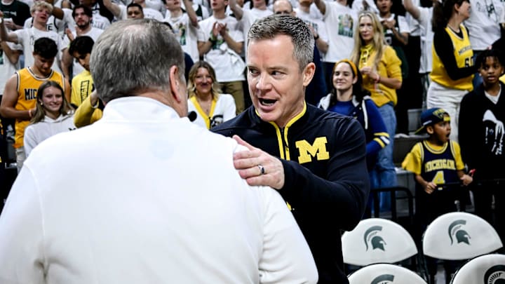 Michigan State's head coach Tom Izzo, left, and Michigan's head coach Dusty May shake hands before the game on Sunday, March 9, 2025, at the Breslin Center in East Lansing. Michigan State's head coach Tom Izzo, left, and Michigan's head coach Dusty May shake hands before the game on Sunday, March 9, 2025, at the Breslin Center in East Lansing.