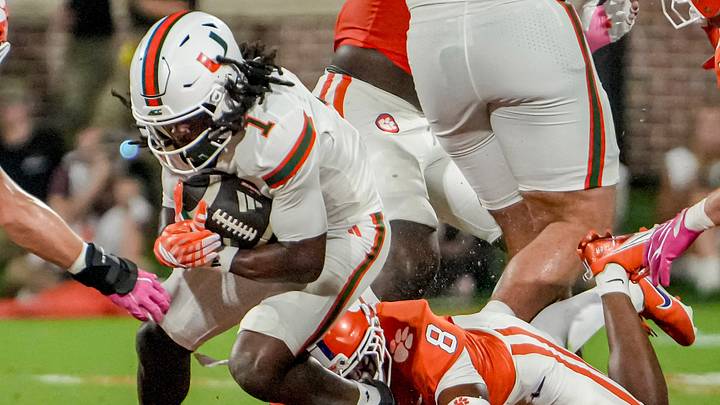 Miami Hurricanes wide receiver Malachi Toney (1) is tackled by Clemson cornerback Corian Gipson (8) during the first quarter at Memorial Stadium Saturday, October 3, 2026.
