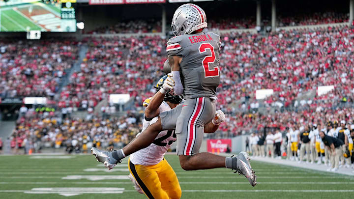 Oct 5, 2024; Columbus, OH, USA; Ohio State Buckeyes wide receiver Emeka Egbuka (2) makes a touchdown catch against Iowa Hawkeyes defensive back Sebastian Castro (29) in the fourth quarter during the NCAA football game at Ohio Stadium.