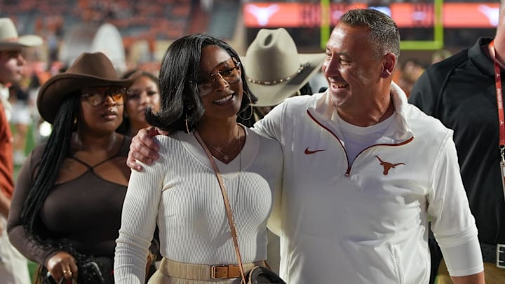 Nov 23, 2024; Texas Longhorns head coach Steve Sarkisian and his wife Loreal Sarkisian walk off the field after defeating the Kentucky Wildcats at Darrell K Royal Texas Memorial Stadium.