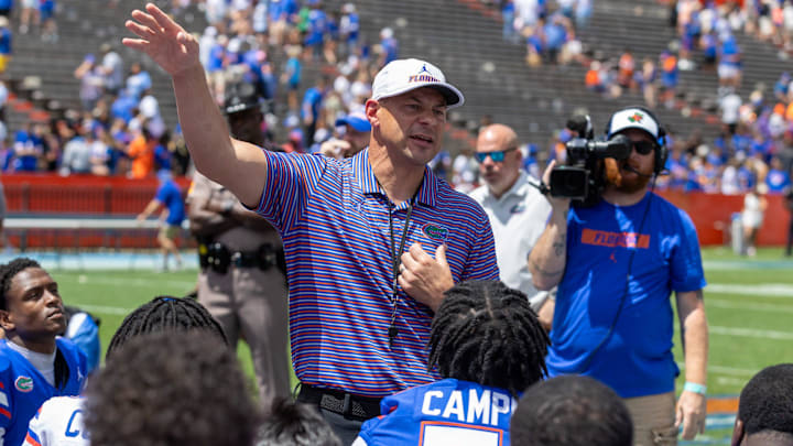 Florida head coach Jon Sumrall speaks to the team after the Orange and Blue game on Saturday.