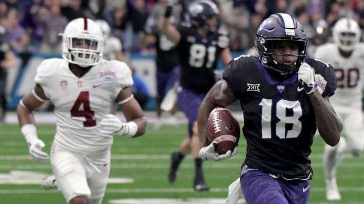 Dec 28, 2017; San Antonio, TX, United States; TCU Horned Frogs wide receiver Jalen Reagor (18) carries the ball past Stanford Cardinal cornerback Alameen Murphy (4) in the 2017 Alamo Bowl at Alamodome. Mandatory Credit: Kirby Lee-USA TODAY Sports Dec 28, 2017; San Antonio, TX, United States; TCU Horned Frogs wide receiver Jalen Reagor (18) carries the ball past Stanford Cardinal cornerback Alameen Murphy (4) in the 2017 Alamo Bowl at Alamodome. Mandatory Credit: Kirby Lee-USA TODAY Sports
