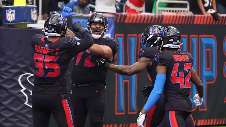 Jan 4, 2026; Houston, Texas, USA;  Houston Texans defensive tackle Tommy Togiai (72) celebrates with teammates after recovering a fumble for a touchdown against the Indianapolis Colts during the second half at NRG Stadium. Mandatory Credit: Thomas Shea-Imagn Images