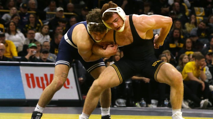 Penn State's Mitchell Mesenbrink wrestles Iowa's Michael Caliendo during a Big Ten dual match in 2024 at Carver-Hawkeye Arena.