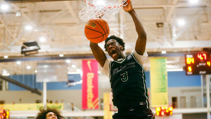 AJ Dybantsa rocks the rim at the Nike Elite Youth Basketball League.