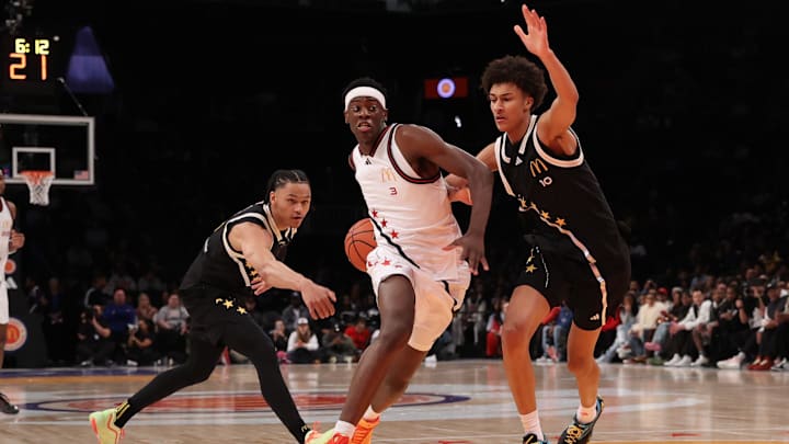 Apr 1, 2025; Brooklyn, NY, USA; McDonald's All American West forward AJ Dybantsa (3) drives to the basket against McDonald's All American East guard Zai Harwell (0) and McDonald's All American East forward Nate Ament (10) during the first half of the game at Barclays Center. Mandatory Credit: Pamela Smith-Imagn Images