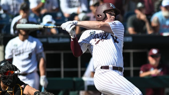 Jun 23, 2024; Omaha, NE, USA;  Texas A&M Aggies infielder Ryan Targac (12) flies out to end the game against the Tennessee Volunteers at Charles Schwab Field Omaha. Mandatory Credit: Steven Branscombe-USA TODAY Sports