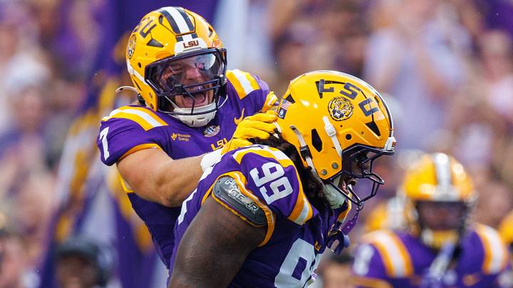 Sep 12, 2026; Baton Rouge, Louisiana, USA; LSU Tigers defensive tackle Deuce Geralds (99) and linebacker Whit Weeks (7) react to sacking Louisiana Tech Bulldogs quarterback Blake Baker (5) during the first half at Tiger Stadium. Mandatory Credit: Stephen Lew-Imagn Images Sep 12, 2026; Baton Rouge, Louisiana, USA; LSU Tigers defensive tackle Deuce Geralds (99) and linebacker Whit Weeks (7) react to sacking Louisiana Tech Bulldogs quarterback Blake Baker (5) during the first half at Tiger Stadium. Mandatory Credit: Stephen Lew-Imagn Images