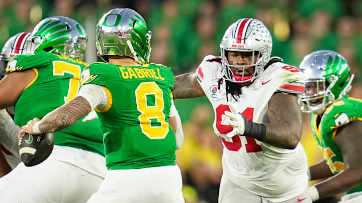 Ohio State Buckeyes defensive tackle Tyleik Williams (91) rushes at Oregon Ducks quarterback Dillon Gabriel at the Rose Bowl.