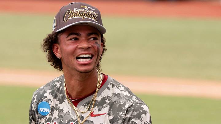 Jun 8, 2026; Tuscaloosa, AL, USA; Alabama shortstop Justin Lebron (1) is all smiles as the Crimson Tide players and coaches celebrate their 7-2 win over St. John’s to earn a trip to the College World Series. Jun 8, 2026; Tuscaloosa, AL, USA; Alabama shortstop Justin Lebron (1) is all smiles as the Crimson Tide players and coaches celebrate their 7-2 win over St. John’s to earn a trip to the College World Series.