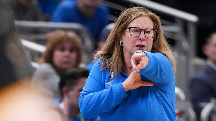 UCLA Bruins head coach Cori Close points up the court Sunday, March 8, 2026, during the Big Ten Tournament Championship game at Gainbridge Fieldhouse in Indianapolis. UCLA Bruins defeated the Iowa Hawkeyes, 96-45, for back to back Big Ten championships.
