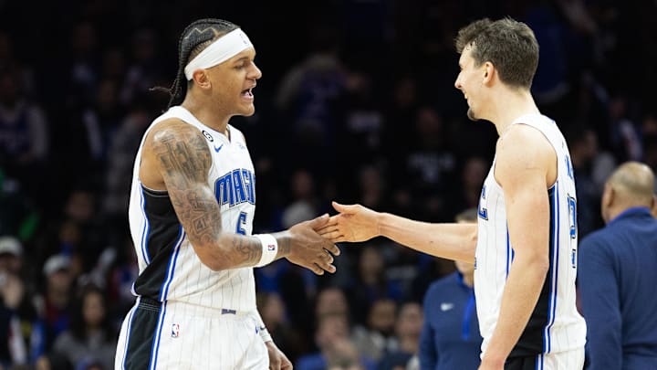 Orlando Magic forward Paolo Banchero (5) and forward Franz Wagner (22) celebrate a score against the Philadelphia 76ers during the fourth quarter at Wells Fargo Center.