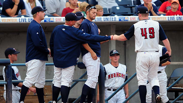 Former Detroit Tigers pitcher Nate Robertson walks off the mound for the Toledo Mud Hens.