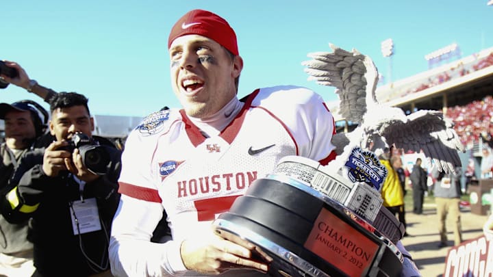 Houston Cougars quarterback Case Keenum (7) celebrates the victory over the Penn State Nittany Lions in the 2012 Ticket City Bowl at Cotton Bowl Stadium. 