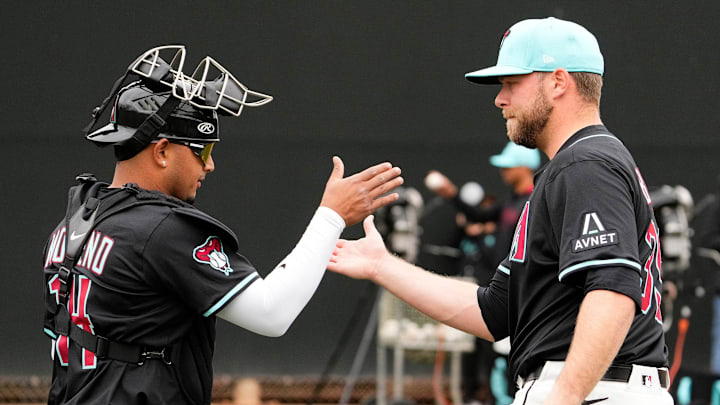 Arizona Diamondbacks catcher Gabriel Moreno greets new pitcher Corbin Burnes after throwing in the bullpen on the first day of spring training practice at Salt River Fields at Talking Stick in Scottsdale on Feb. 12, 2025. Arizona Diamondbacks catcher Gabriel Moreno greets new pitcher Corbin Burnes after throwing in the bullpen on the first day of spring training practice at Salt River Fields at Talking Stick in Scottsdale on Feb. 12, 2025.