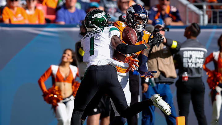 Oct 23, 2022; Denver, Colorado, USA; New York Jets cornerback Sauce Gardner (1) breaks up a pass intended for Denver Broncos wide receiver Courtland Sutton (14) in the second quarter at Empower Field at Mile High. 
