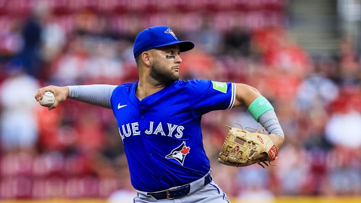 Sep 2, 2025; Cincinnati, Ohio, USA; Toronto Blue Jays shortstop Bo Bichette (11) throws to first to get Cincinnati Reds third baseman Ke'Bryan Hayes (not pictured) out in the second inning at Great American Ball Park. 