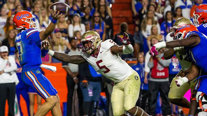 Florida State Seminoles defensive lineman Jared Verse (5) pressures Florida Gators quarterback Max Brown (17) at Steve Spurrier Field at Ben Hill Griffin Stadium in Gainesville, FL on Saturday, November 25, 2023 during the second half. Florida State won 24-15. [Doug Engle/Gainesville Sun]