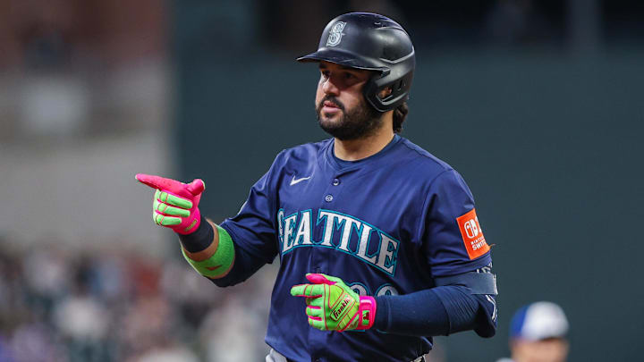 Sep 6, 2025; Cumberland, Georgia, USA; Seattle Mariners third base Eugenio Suarez (28) celebrates hitting a home run against the Atlanta Braves during the seventh inning at Truist Park. Mandatory Credit: Jordan Godfree-Imagn Images