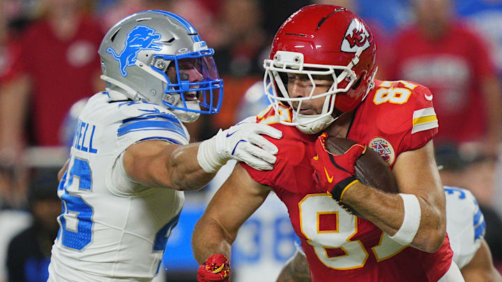 Oct 12, 2025; Kansas City, Missouri, USA; Kansas City Chiefs tight end Travis Kelce (87) makes a catch against Detroit Lions linebacker Jack Campbell (46) during the first half at GEHA Field at Arrowhead Stadium. Mandatory Credit: Jay Biggerstaff-Imagn Images