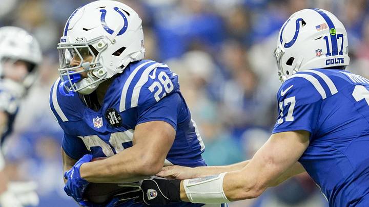 Dec 28, 2025; Indianapolis, Indiana, USA; Indianapolis Colts quarterback Philip Rivers (17) hands the ball to Indianapolis Colts running back Jonathan Taylor (28) during a game against the Jacksonville Jaguars  at Lucas Oil Stadium. Mandatory Credit: IndyStar-USA TODAY Network via Imagn Images