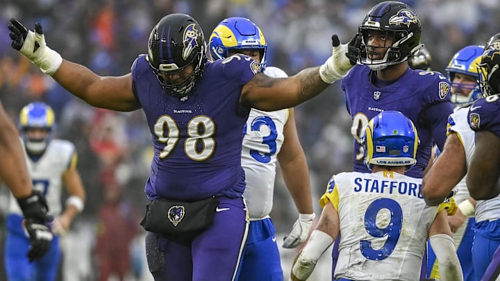 Dec 10, 2023; Baltimore, Maryland, USA; Baltimore Ravens defensive tackle Travis Jones (98) reacts after sacking Los Angeles Rams quarterback Matthew Stafford (9)  during the second  half at M&T Bank Stadium. Mandatory Credit: Tommy Gilligan-Imagn Images