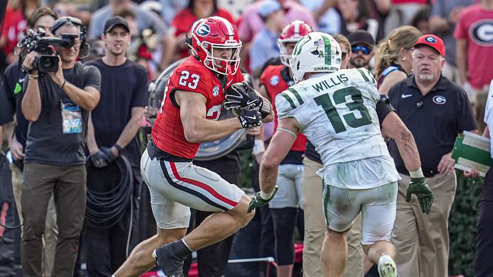 Nov 22, 2025; Athens, Georgia, USA; Georgia Bulldogs tight end Jaden Reddell (23) runs against Charlotte 49ers linebacker Gavin Willis (13) during the first half at Sanford Stadium. Mandatory Credit: Dale Zanine-Imagn Images Nov 22, 2025; Athens, Georgia, USA; Georgia Bulldogs tight end Jaden Reddell (23) runs against Charlotte 49ers linebacker Gavin Willis (13) during the first half at Sanford Stadium. Mandatory Credit: Dale Zanine-Imagn Images