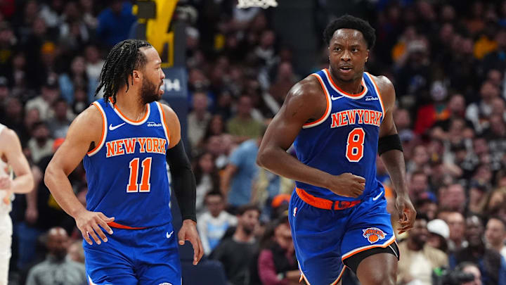 Nov 25, 2024; Denver, Colorado, USA; New York Knicks guard Jalen Brunson (11) reacts towards forward OG Anunoby (8) in the second quarter against the Denver Nuggets at Ball Arena. Mandatory Credit: Ron Chenoy-Imagn Images