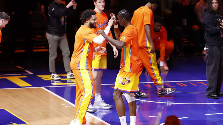 Jan 31, 2026; Charlotte, North Carolina, USA; Charlotte Hornets forward Miles Bridges (left) shakes hands with forward Moussa Diabate (right) during player introductions at Spectrum Center. Mandatory Credit: Brian Westerholt-Imagn Images