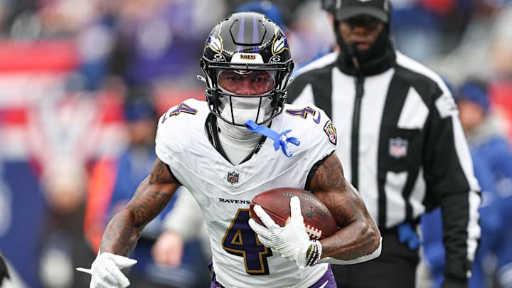 Dec 15, 2024; East Rutherford, New Jersey, USA; Baltimore Ravens wide receiver Zay Flowers (4) carries the ball against the New York Giants during the first quarter at MetLife Stadium. Mandatory Credit: Vincent Carchietta-Imagn Images Dec 15, 2024; East Rutherford, New Jersey, USA; Baltimore Ravens wide receiver Zay Flowers (4) carries the ball against the New York Giants during the first quarter at MetLife Stadium. Mandatory Credit: Vincent Carchietta-Imagn Images