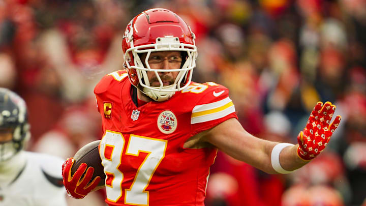 Jan 18, 2025; Kansas City, Missouri, USA; Kansas City Chiefs tight end Travis Kelce (87) runs with the ball during the first half against Houston Texans in a 2025 AFC divisional round game at GEHA Field at Arrowhead Stadium.