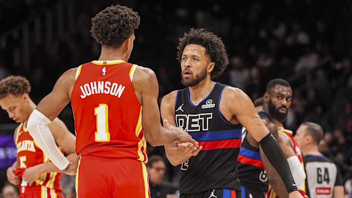 Jan 22, 2025; Atlanta, Georgia, USA; Detroit Pistons guard Cade Cunningham (2) and Atlanta Hawks forward Jalen Johnson (1) : Dale Zanine-Imagn Images