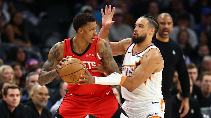 Nov 24, 2025; Phoenix, Arizona, USA; Houston Rockets forward Jabari Smith Jr. (10) against Phoenix Suns forward Dillon Brooks (3) at Mortgage Matchup Center. Mandatory Credit: Mark J. Rebilas-Imagn Images