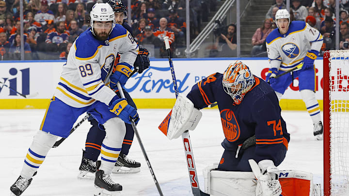 Mar 21, 2024; Edmonton, Alberta, CAN; Buffalo Sabres forward Alex Tuch (89) tries to get to a loose