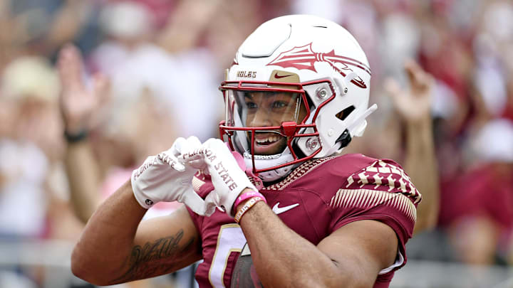 Oct 29, 2022; Tallahassee, Florida, USA; Florida State Seminoles wide receiver Ja'Khi Douglas (0) celebrates a touchdown during the game against the Georgia Tech Yellow Jackets at Doak S. Campbell Stadium. Mandatory Credit: Melina Myers-Imagn Images Oct 29, 2022; Tallahassee, Florida, USA; Florida State Seminoles wide receiver Ja'Khi Douglas (0) celebrates a touchdown during the game against the Georgia Tech Yellow Jackets at Doak S. Campbell Stadium. Mandatory Credit: Melina Myers-Imagn Images