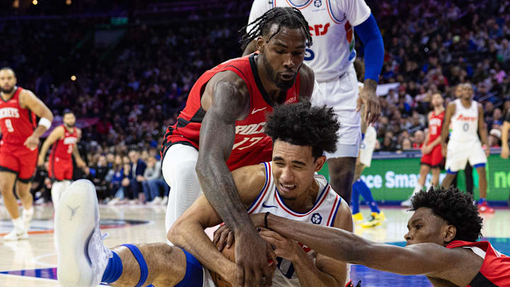 Nov 27, 2024; Philadelphia, Pennsylvania, USA; Philadelphia 76ers guard Jared McCain (20) controls a loose ball against Houston Rockets forward Tari Eason (17) and forward Amen Thompson (1) during the fourth quarter at Wells Fargo Center. Mandatory Credit: Bill Streicher-Imagn Images Nov 27, 2024; Philadelphia, Pennsylvania, USA; Philadelphia 76ers guard Jared McCain (20) controls a loose ball against Houston Rockets forward Tari Eason (17) and forward Amen Thompson (1) during the fourth quarter at Wells Fargo Center. Mandatory Credit: Bill Streicher-Imagn Images